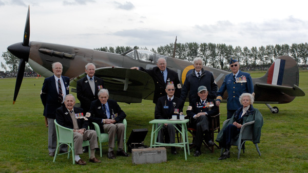 WWII Spitfire pilots seated with Spitfire