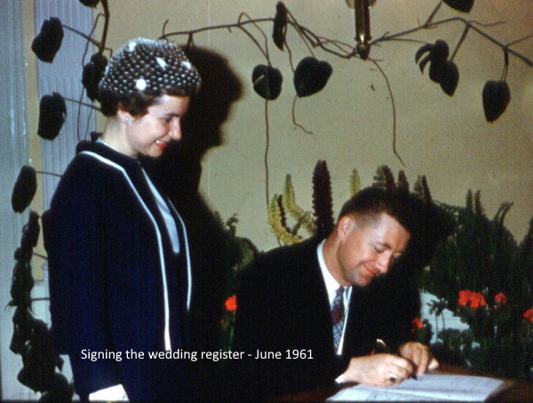 Claire and Neil signing at wedding 1961
